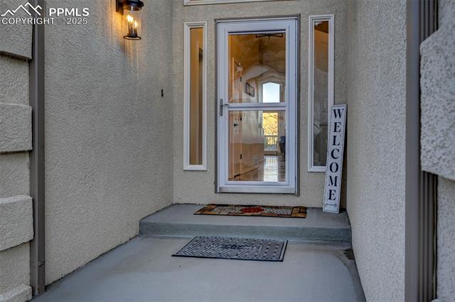 7790 Julynn Road Colorado Springs, CO 80919 - Photo 5 of 50 Covered front porch all new light fixtures.