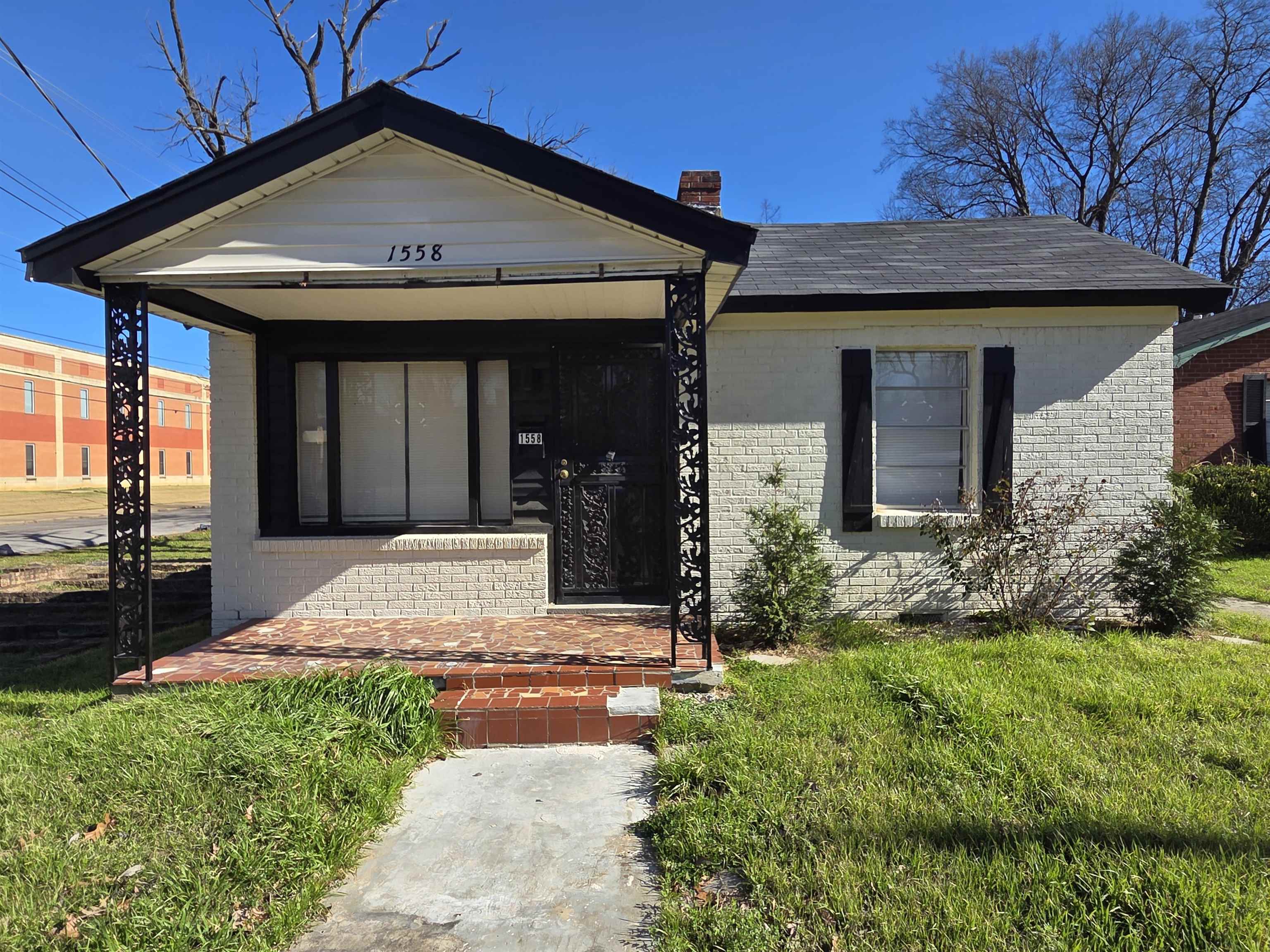 1558 Tayner Street Memphis, TN 38108 - Photo 1 of 12 a front view of a house with garden