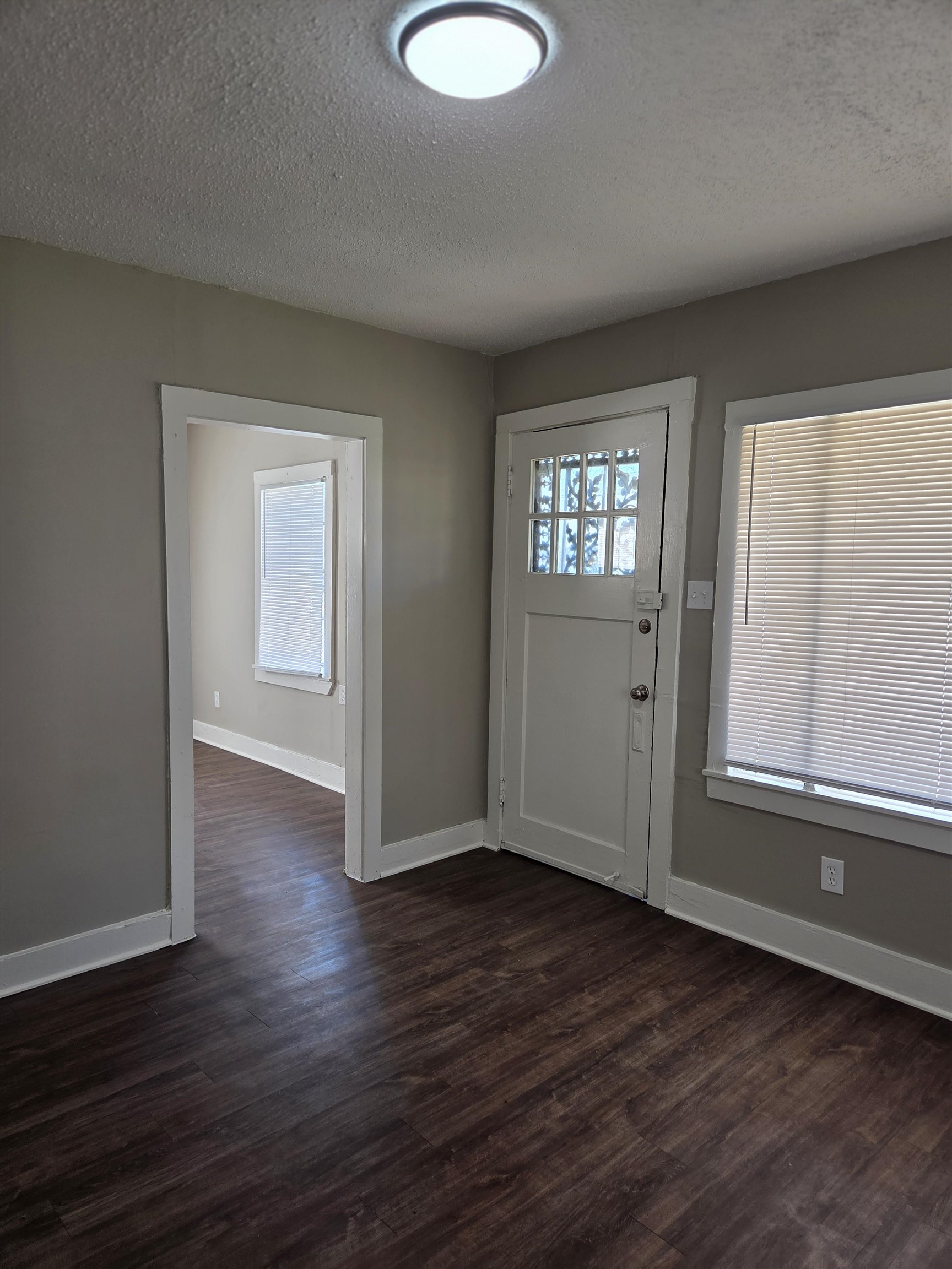 1558 Tayner Street Memphis, TN 38108 - Photo 12 of 12 an empty room with wooden floor and windows
