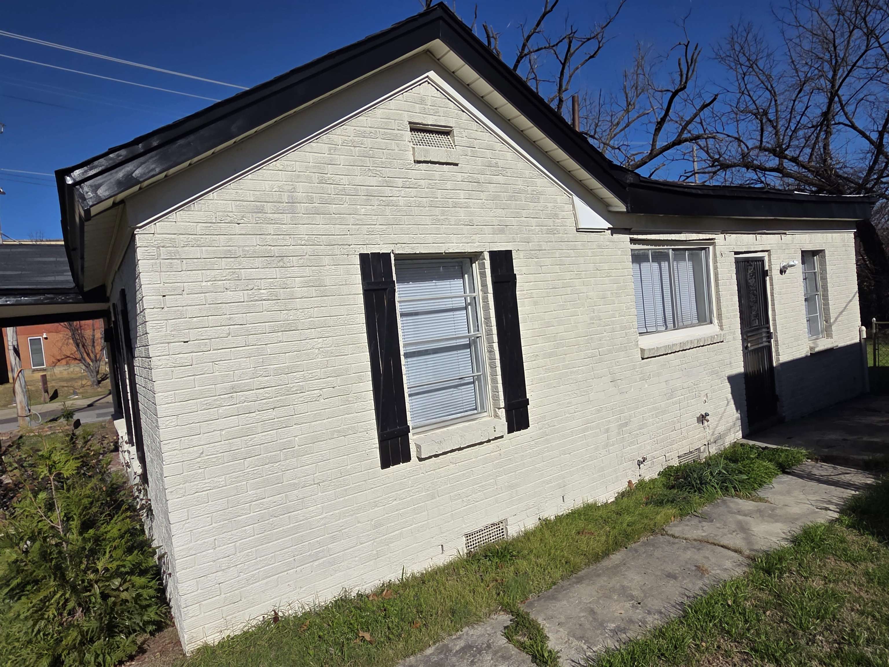 1558 Tayner Street Memphis, TN 38108 - Photo 3 of 12 a front view of a house with a yard