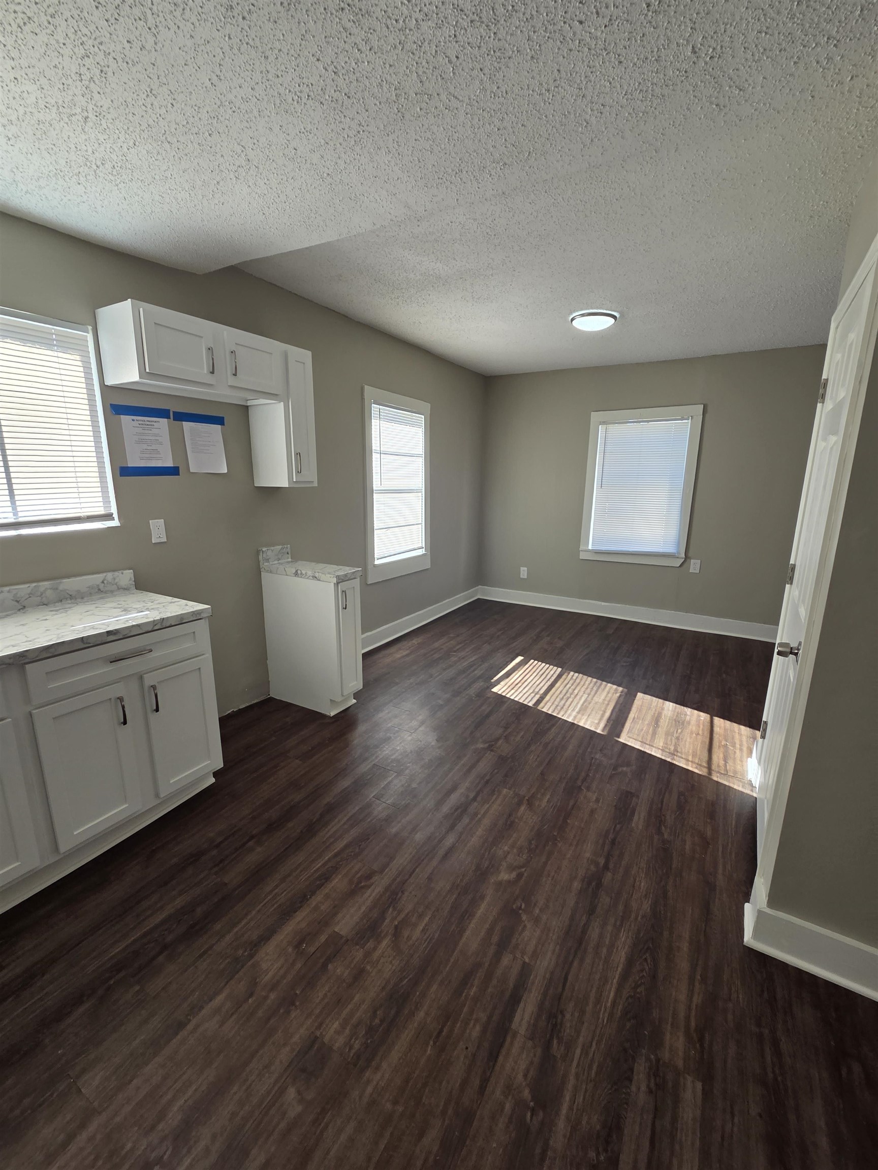 1558 Tayner Street Memphis, TN 38108 - Photo 6 of 12 a view of empty room with wooden floor and fan