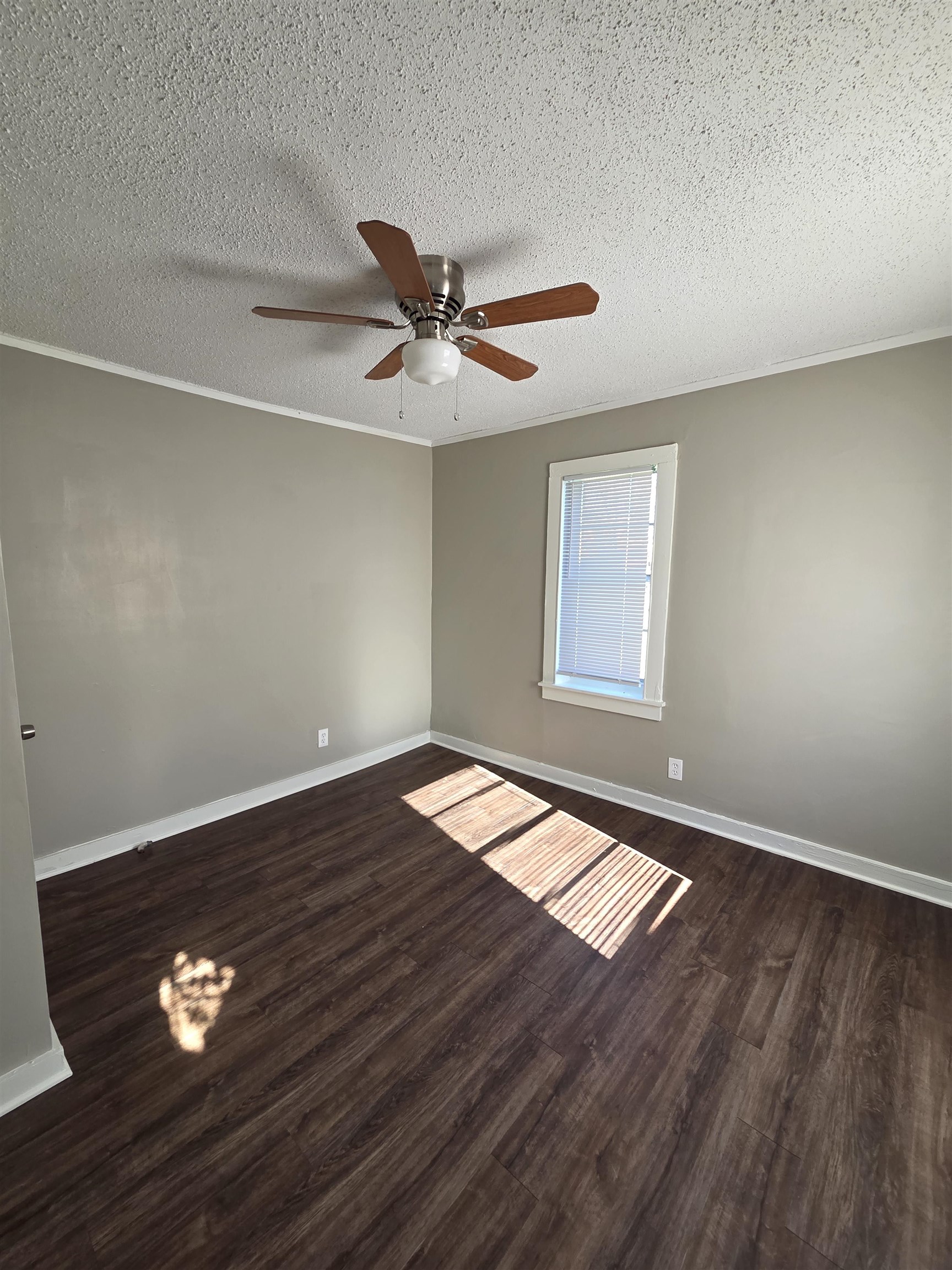 1558 Tayner Street Memphis, TN 38108 - Photo 9 of 12 a view of empty room with wooden floor and fan