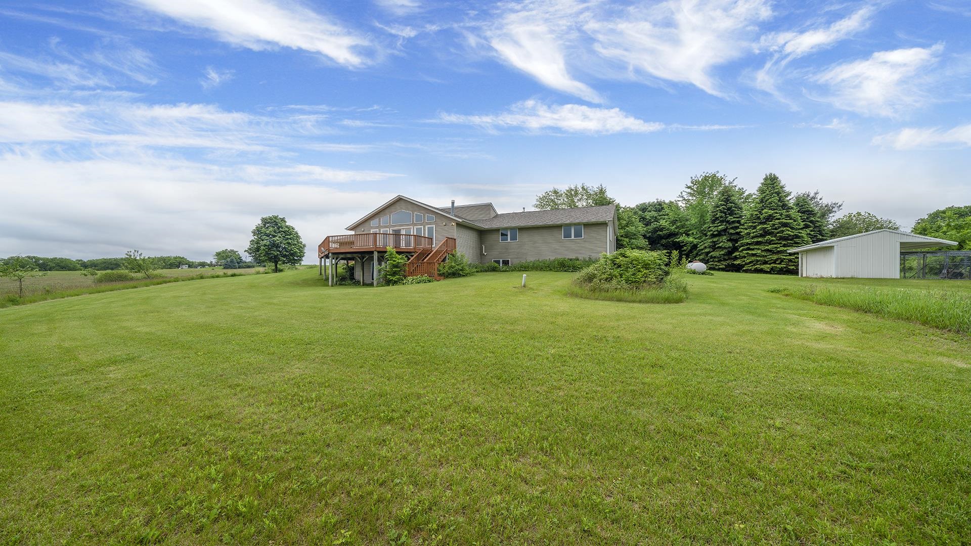 14853 Laube Road Durand, IL 61024 - Photo 33 of 42 a view of a garden with a building in the background