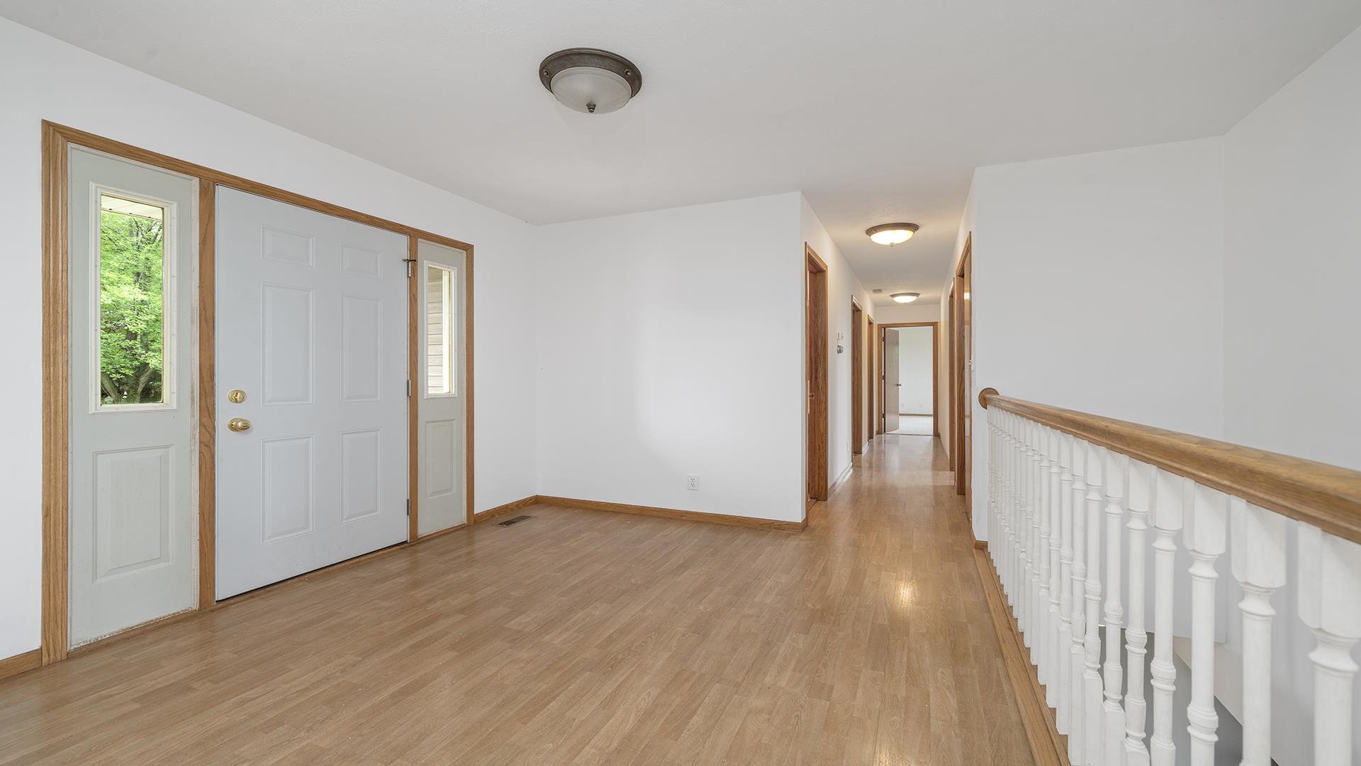 14853 Laube Road Durand, IL 61024 - Photo 4 of 42 a view of a hallway with wooden floor