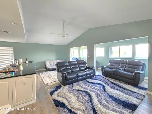 a living room with furniture and a rug