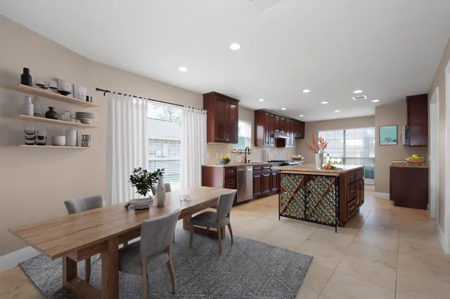 a kitchen with a table and chairs in it