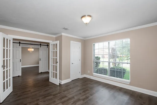 a view of a livingroom with wooden floor