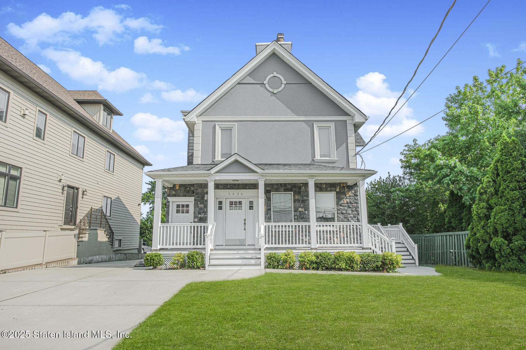 5434 Amboy Road Staten Island, NY 10312 - Photo 1 of 51 a front view of a house with a yard
