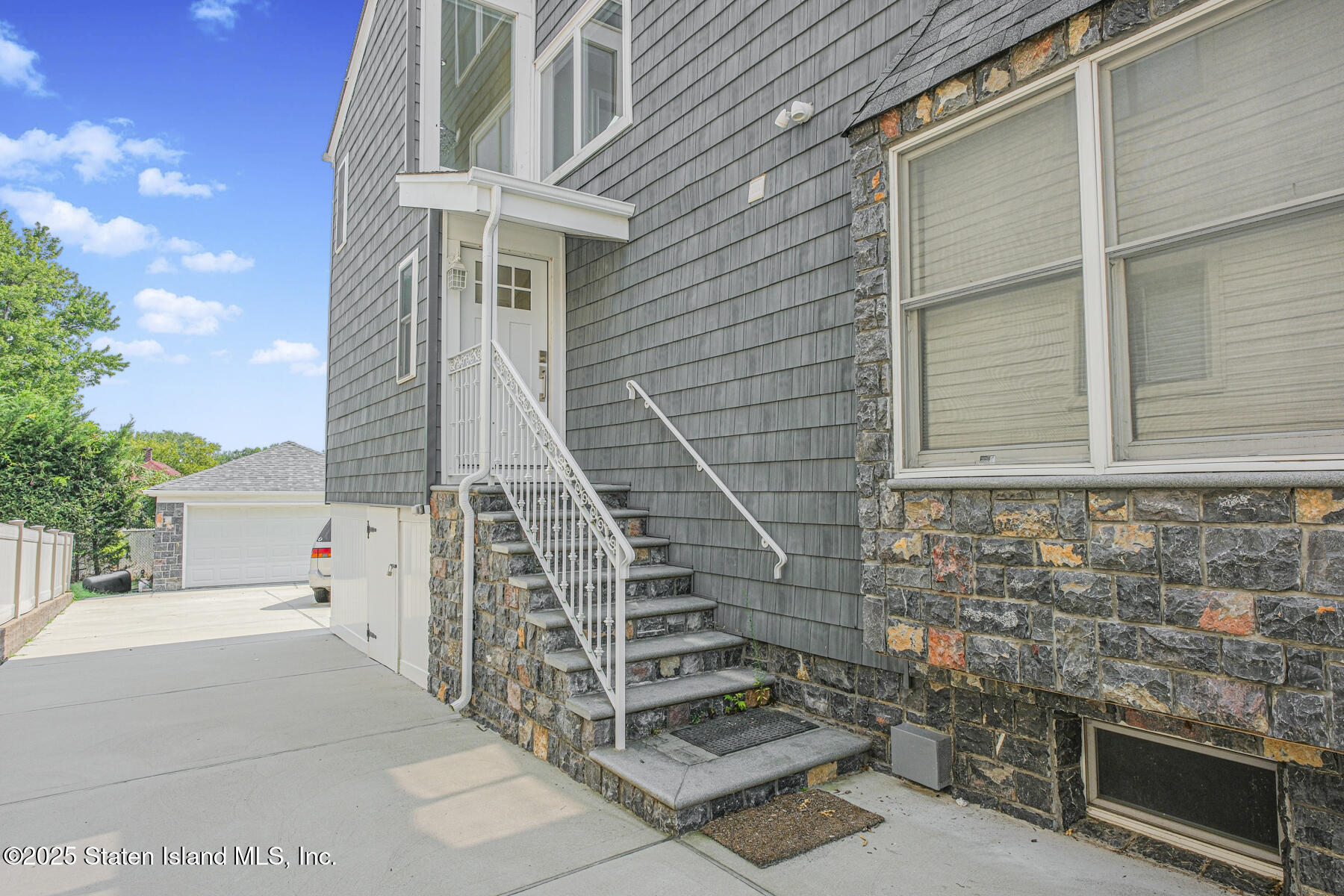 5434 Amboy Road Staten Island, NY 10312 - Photo 11 of 51 a front view of a house with large windows