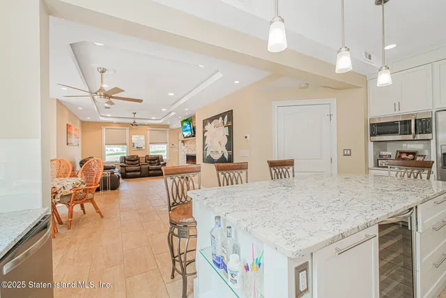 a view of a kitchen and dining room