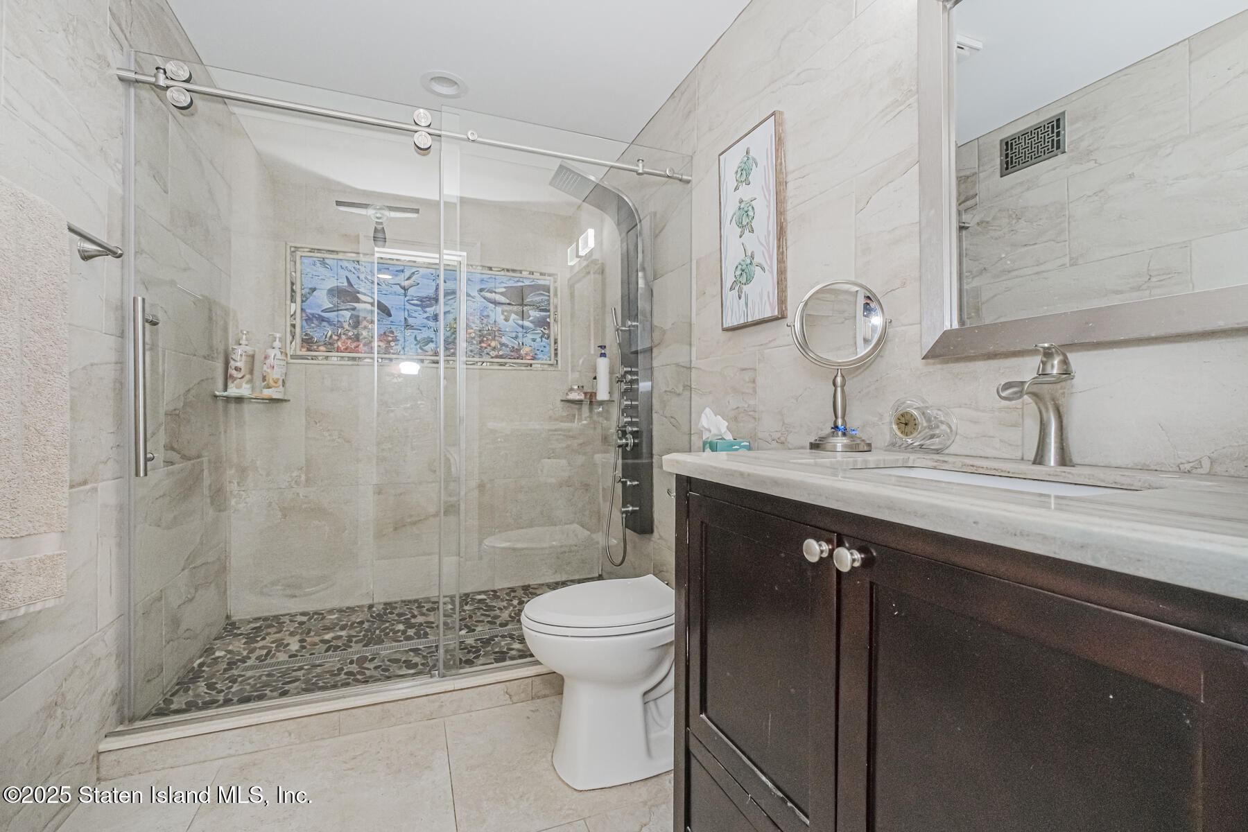 5434 Amboy Road Staten Island, NY 10312 - Photo 24 of 51 a bathroom with a sink a toilet and shower
