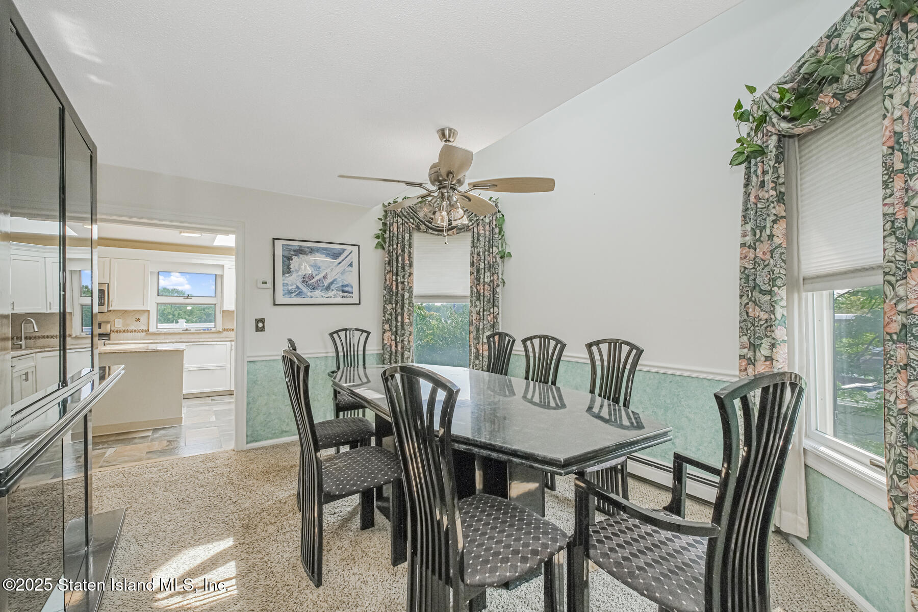 5434 Amboy Road Staten Island, NY 10312 - Photo 30 of 51 a dining room with furniture a chandelier and wooden floor
