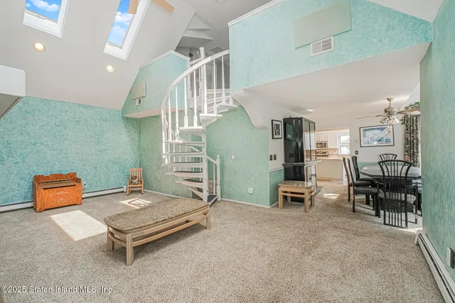 a living room with furniture and a table