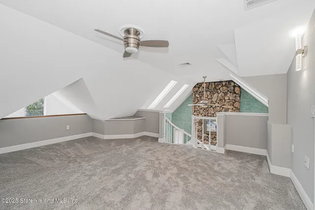 an empty room with windows and entrance