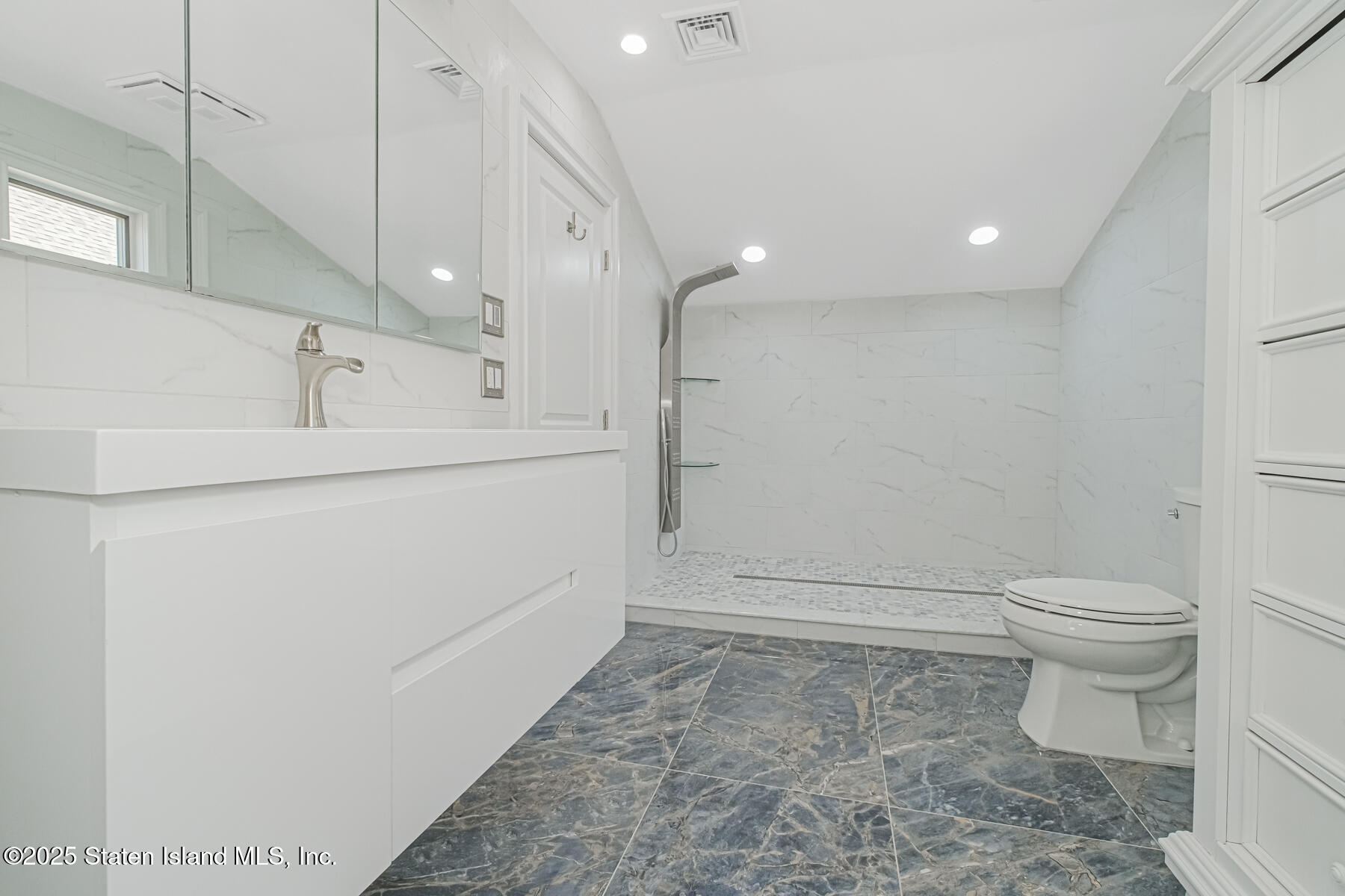 5434 Amboy Road Staten Island, NY 10312 - Photo 36 of 51 a bathroom with a sink a toilet and shower