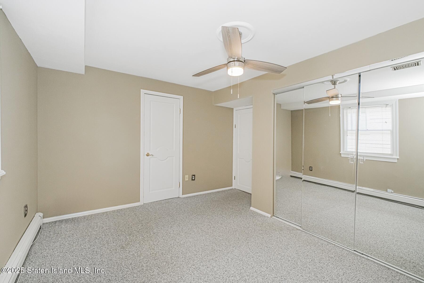 5434 Amboy Road Staten Island, NY 10312 - Photo 38 of 51 a view of an empty room with a window