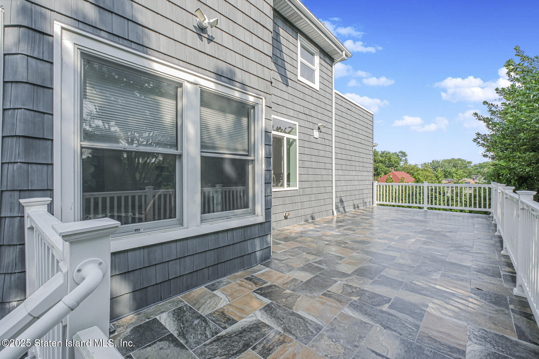 5434 Amboy Road Staten Island, NY 10312 - Photo 8 of 51 a view of house with a window and wooden floor