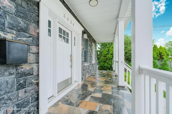 a front view of a house with a porch