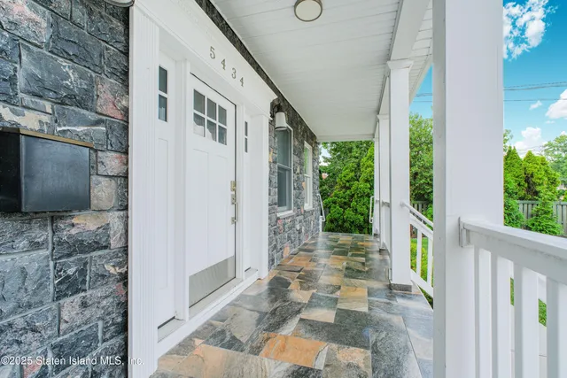 a front view of a house with a porch