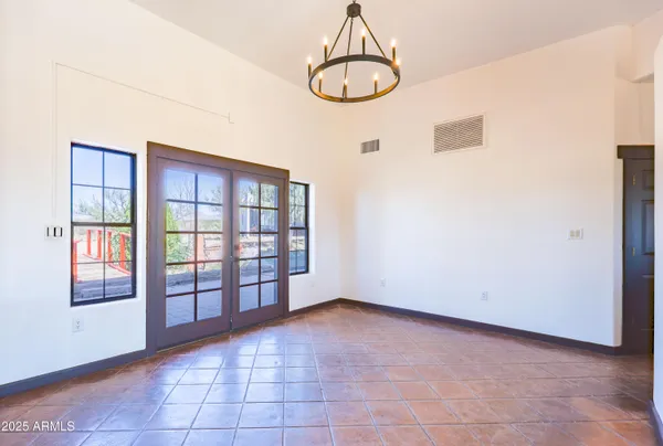a view of an empty room with windows