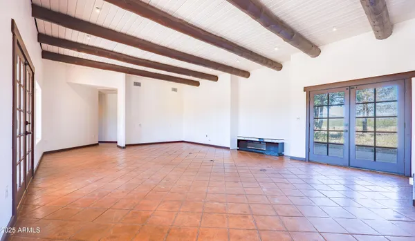 a view of an entryway with wooden floor and windows