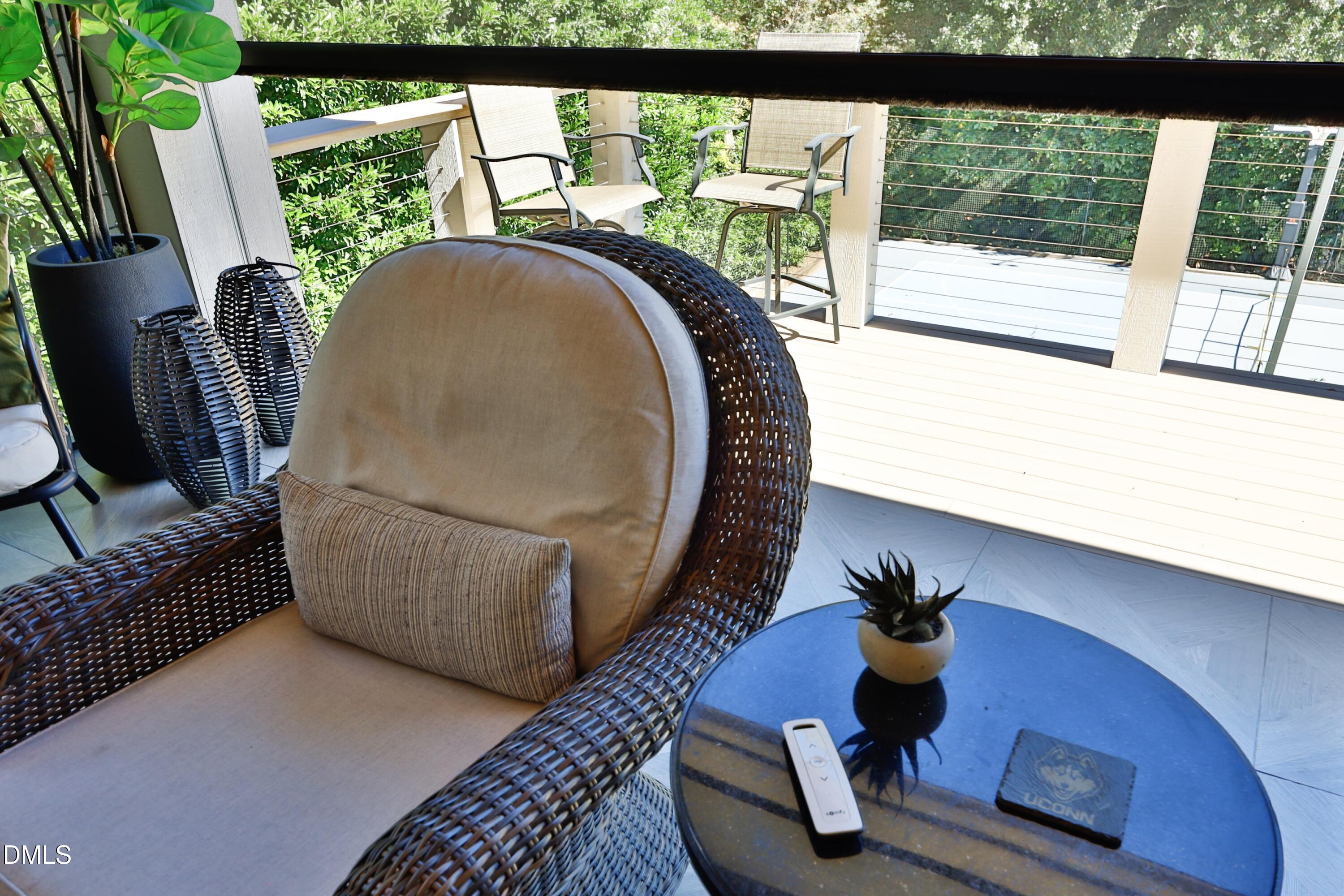 2608 St Marys Street Raleigh, NC 27609 - Photo 24 of 89 a living room with furniture and a floor to ceiling window