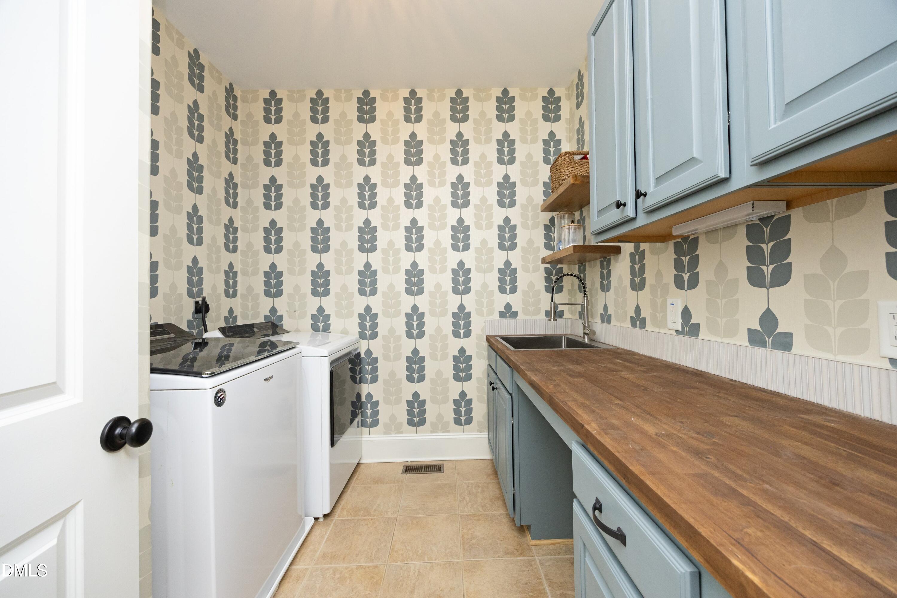 2608 St Marys Street Raleigh, NC 27609 - Photo 37 of 89 a kitchen with stainless steel appliances granite countertop a stove and a sink