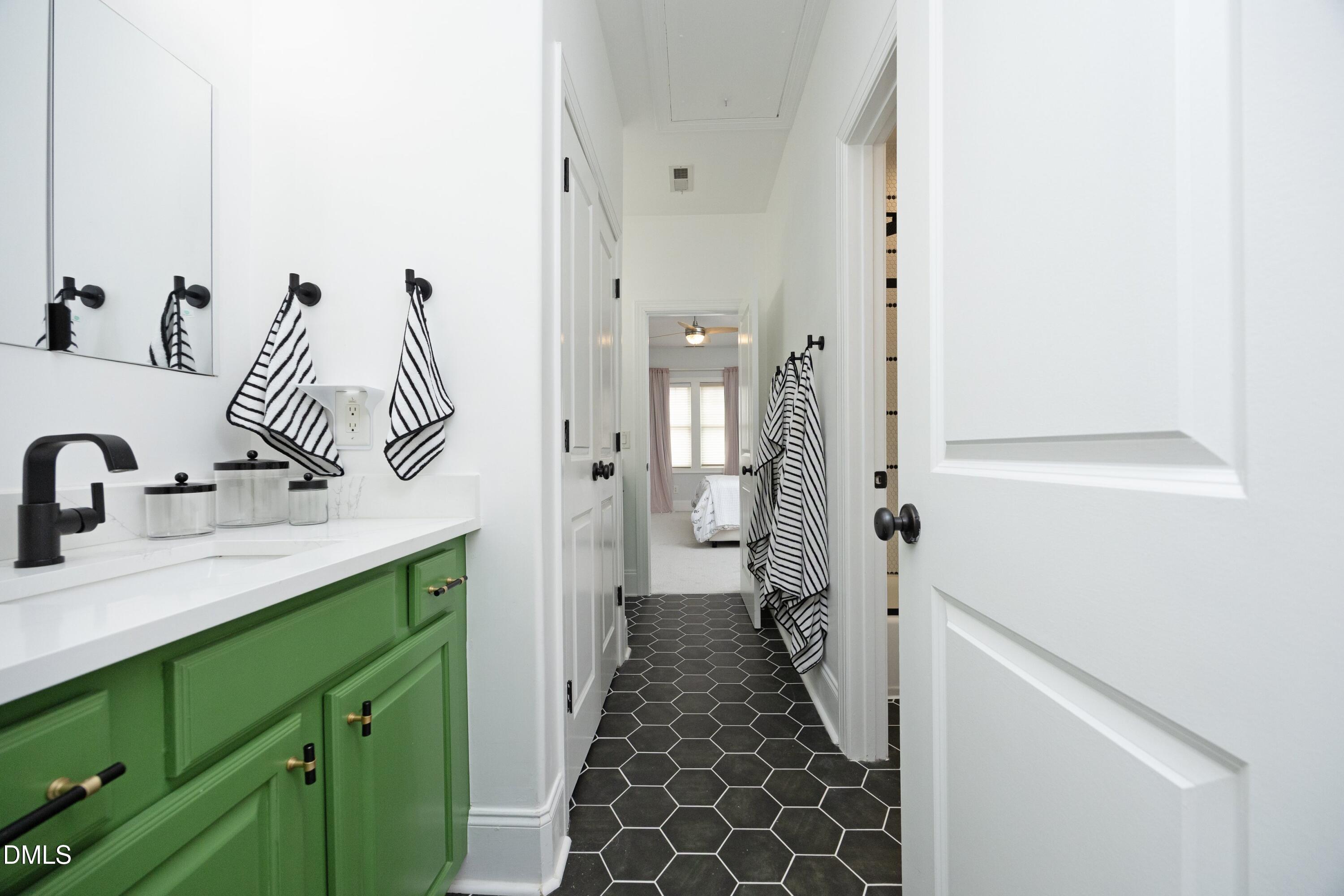 2608 St Marys Street Raleigh, NC 27609 - Photo 44 of 89 a bathroom with a double vanity sink and a mirror