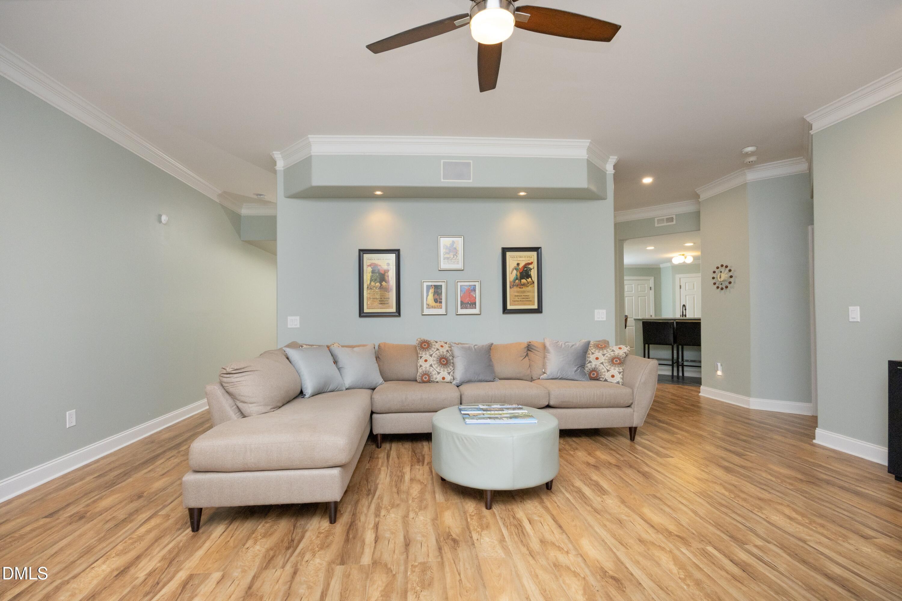 2608 St Marys Street Raleigh, NC 27609 - Photo 51 of 89 a living room with furniture and a wooden floor