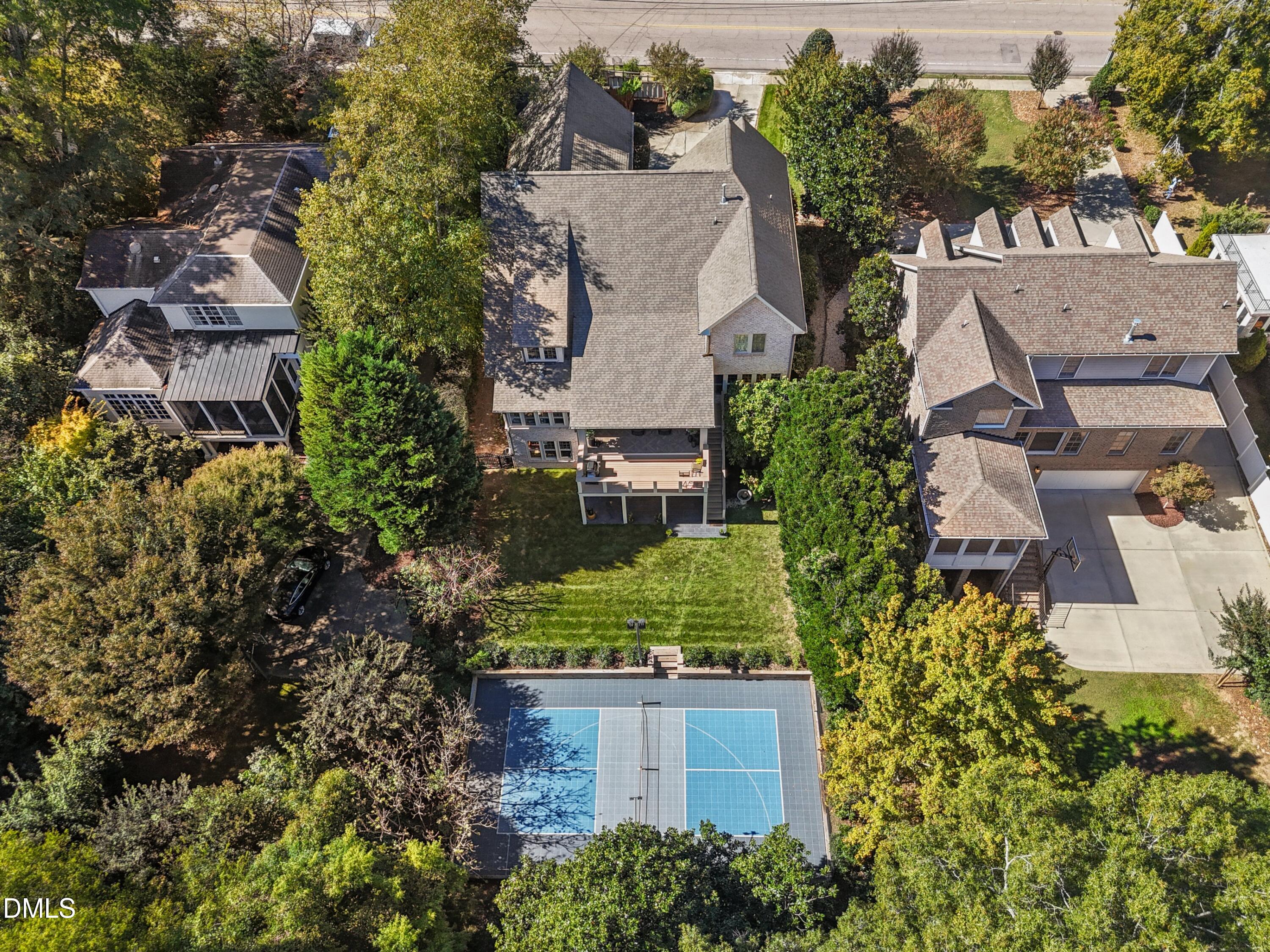 2608 St Marys Street Raleigh, NC 27609 - Photo 70 of 89 an aerial view of a house with a yard and lake view