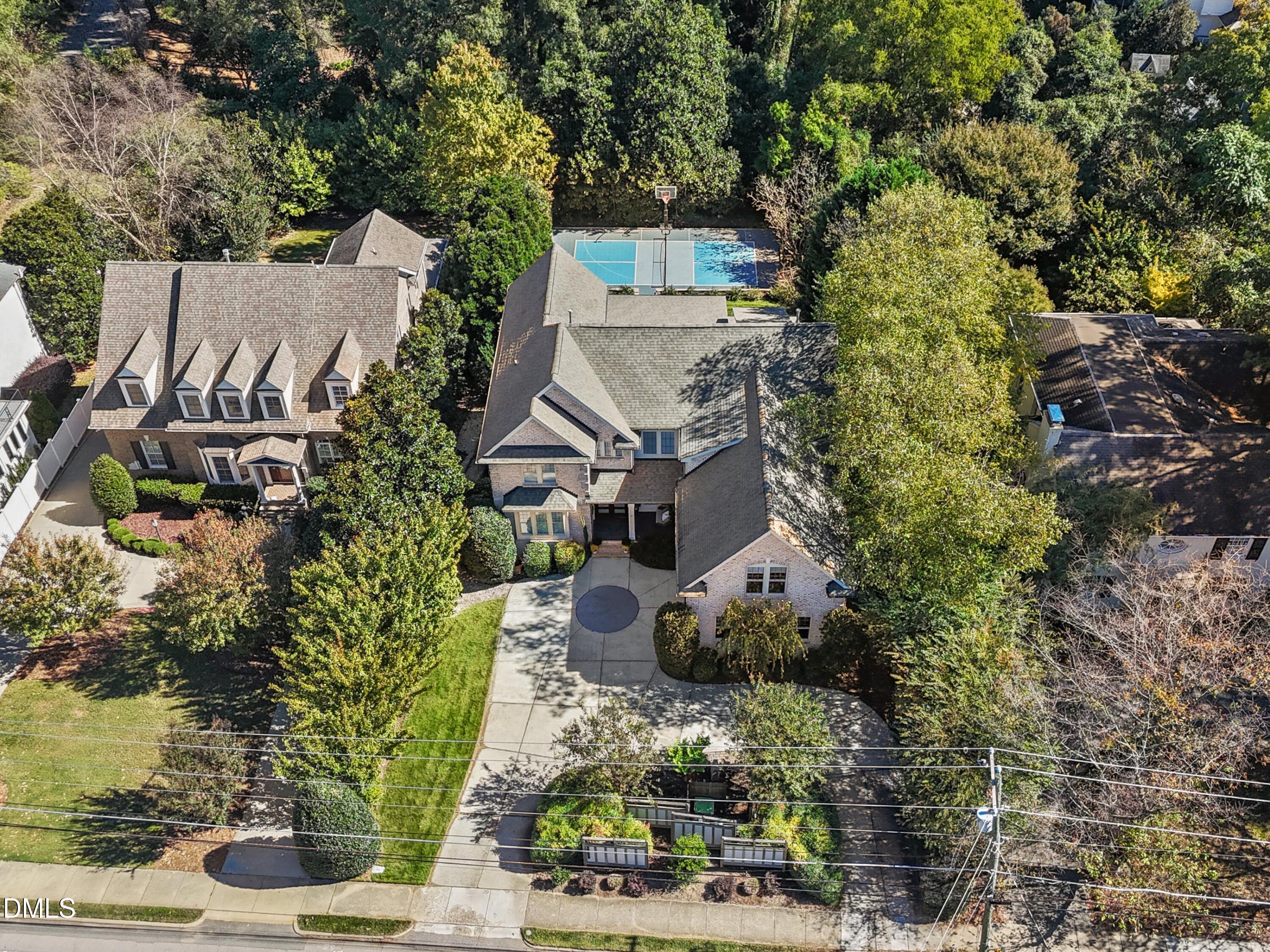 2608 St Marys Street Raleigh, NC 27609 - Photo 72 of 89 an aerial view of a house with a yard and large trees