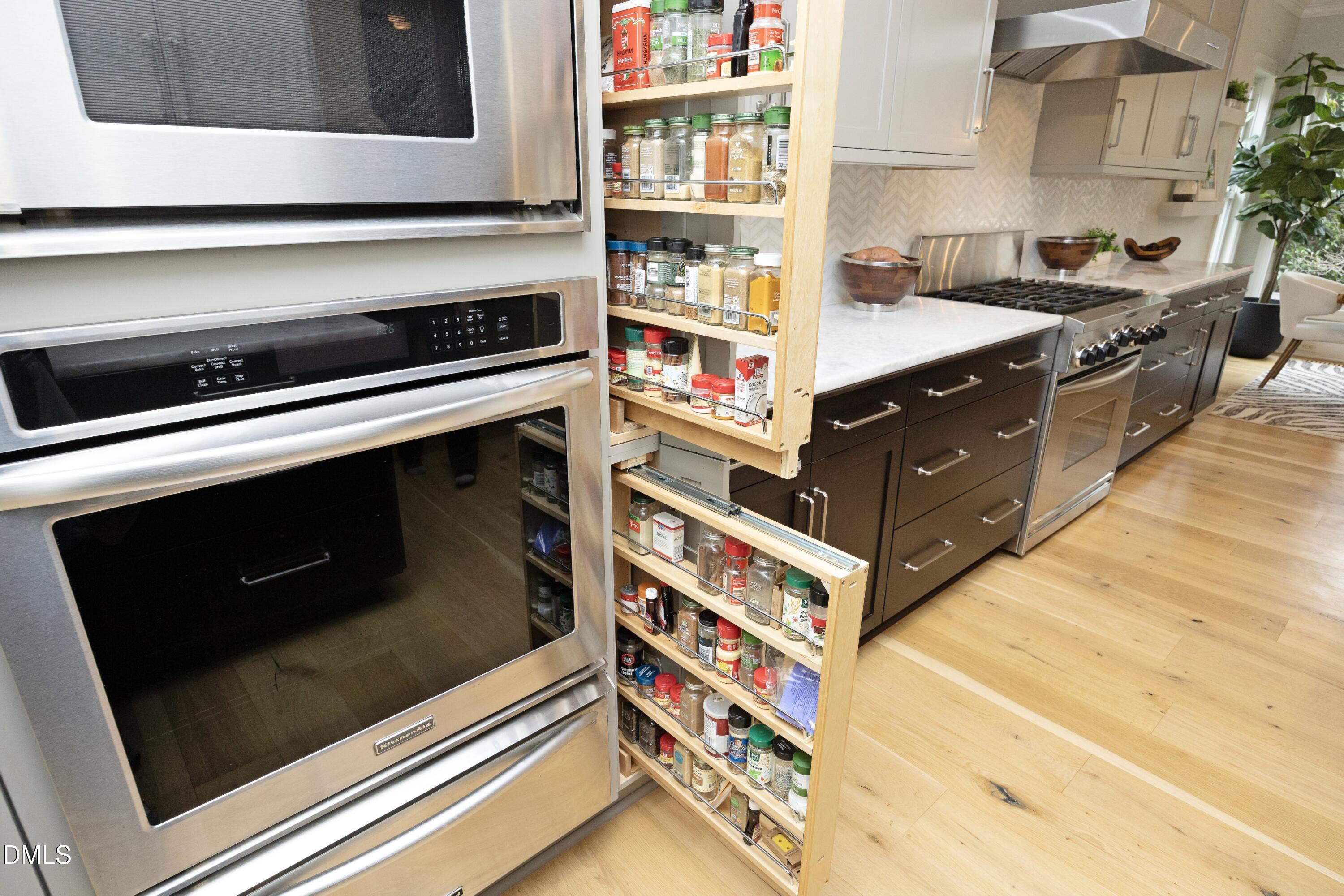 2608 St Marys Street Raleigh, NC 27609 - Photo 9 of 89 a kitchen with stainless steel appliances granite countertop a stove and a sink
