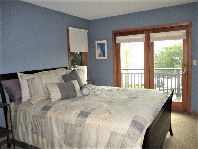 527 Baintree Road Lake Summerset, IL 61019 - Photo 17 of 36 a bedroom with a large bed and a large window