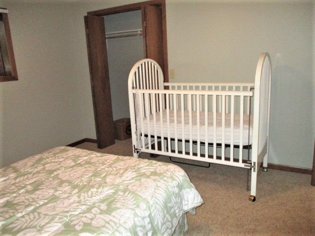 527 Baintree Road Lake Summerset, IL 61019 - Photo 22 of 36 a bed sitting in a bedroom next to a window