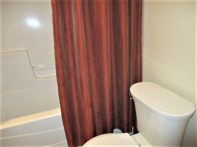 527 Baintree Road Lake Summerset, IL 61019 - Photo 25 of 36 a white toilet sitting next to a shower