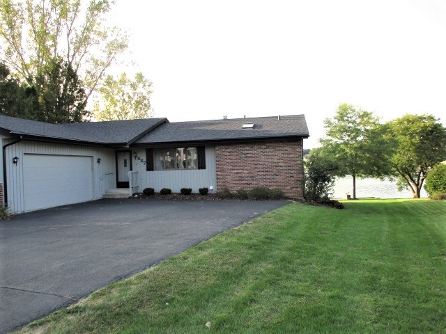 527 Baintree Road Lake Summerset, IL 61019 - Photo 29 of 36 a view of a house with a backyard and a tree