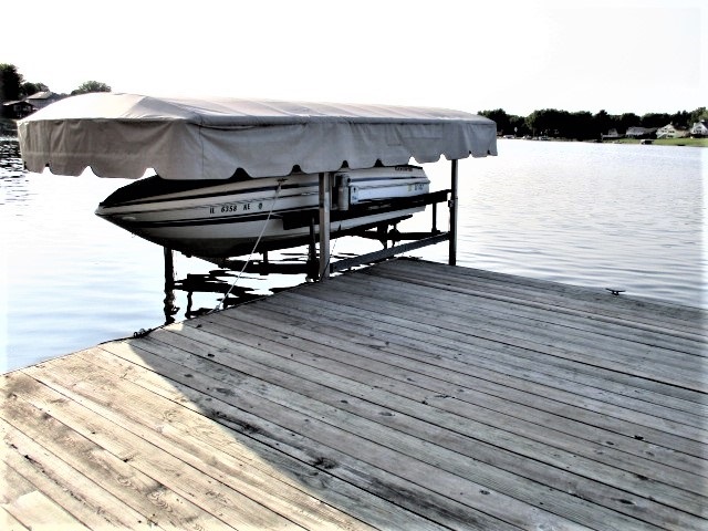527 Baintree Road Lake Summerset, IL 61019 - Photo 33 of 36 a view of a roof deck with table and chairs with wooden floor