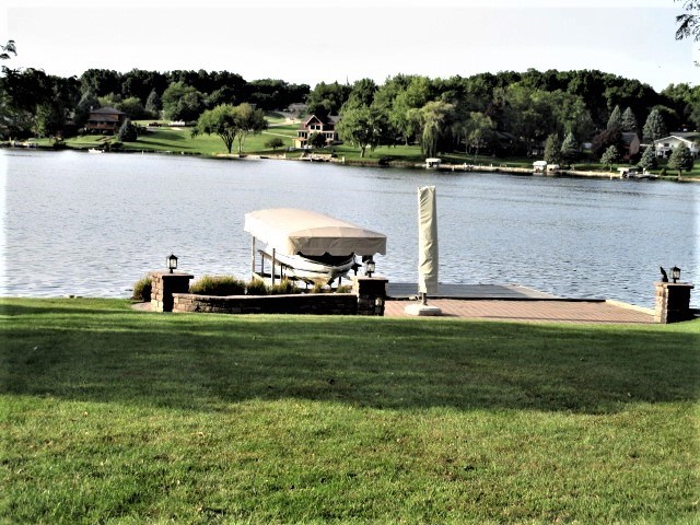 527 Baintree Road Lake Summerset, IL 61019 - Photo 36 of 36 a view of a fountain in a yard next to a lake