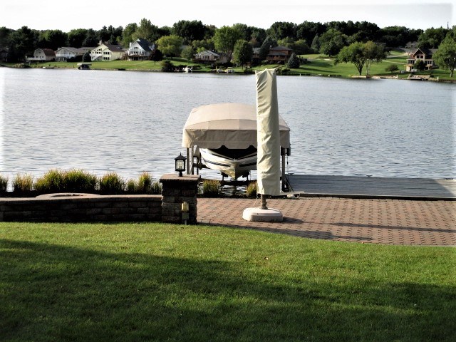 527 Baintree Road Lake Summerset, IL 61019 - Photo 4 of 36 a view of a lake with houses in the background