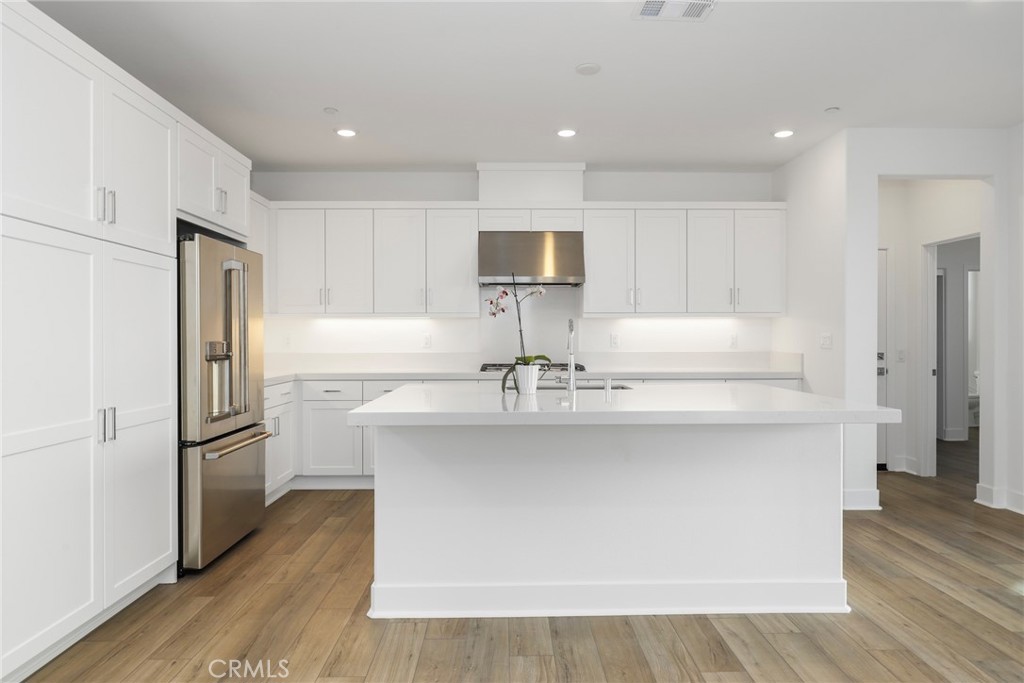 27213 Tamarack Lane Valencia, CA 91381 - Photo 14 of 40 a kitchen with stainless steel appliances a refrigerator and a sink