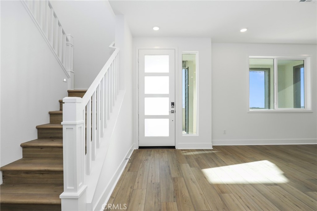 27213 Tamarack Lane Valencia, CA 91381 - Photo 18 of 40 a view of entryway with wooden floor