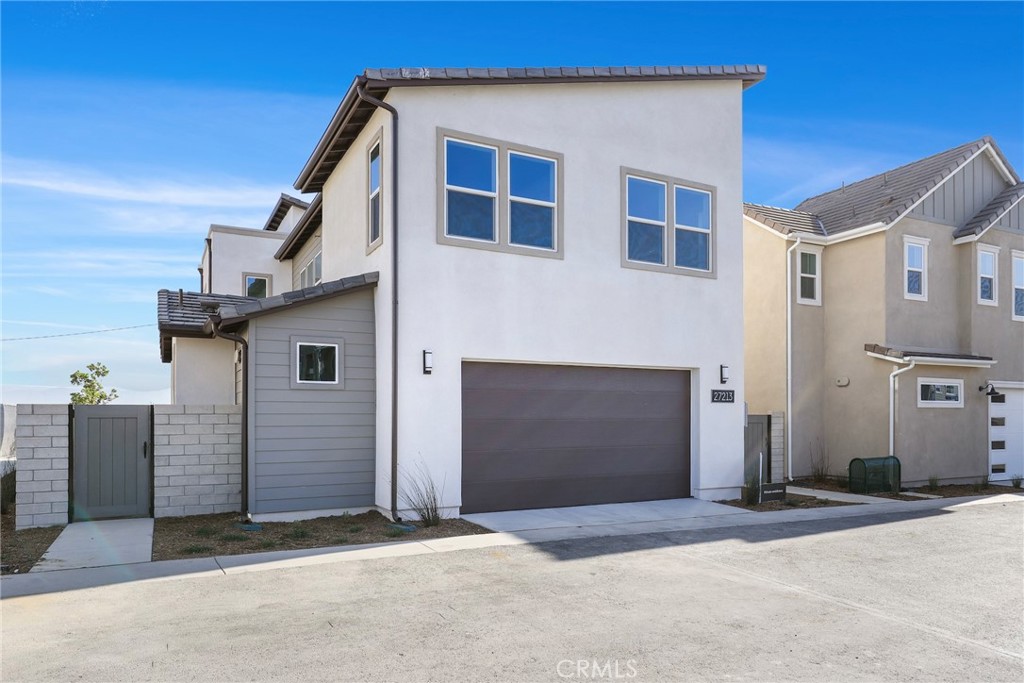 27213 Tamarack Lane Valencia, CA 91381 - Photo 34 of 40 a front view of a house with a garage