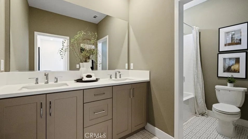 27213 Tamarack Lane Valencia, CA 91381 - Photo 8 of 40 a bathroom with a toilet a sink a mirror and a shower