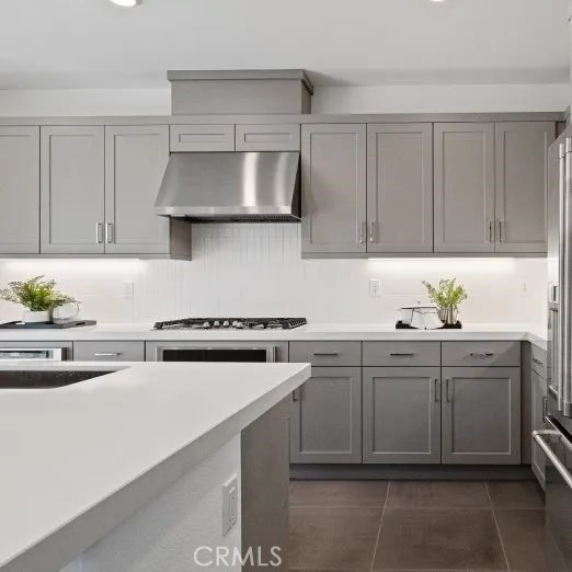 27213 Tamarack Lane Valencia, CA 91381 - Photo 10 of 40 a kitchen with a sink a stove and cabinets