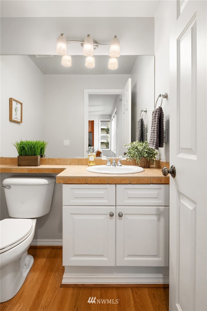17018 166th Place Southeast Renton, WA 98058 - Photo 18 of 34 a bathroom with a sink a toilet and mirror