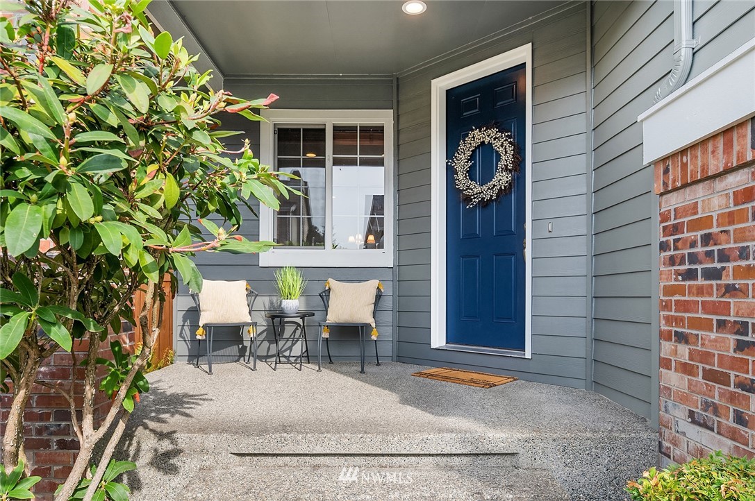 17018 166th Place Southeast Renton, WA 98058 - Photo 3 of 34 a view of a patio with table and chairs and potted plants
