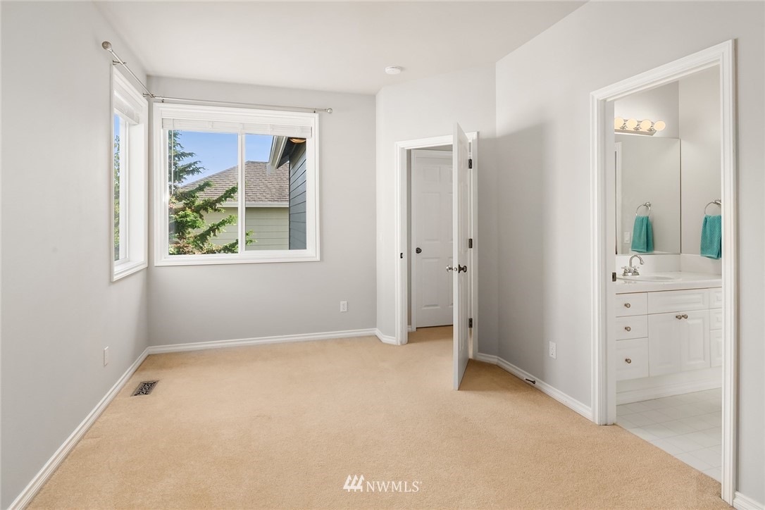 17018 166th Place Southeast Renton, WA 98058 - Photo 26 of 34 an empty room with windows and closet