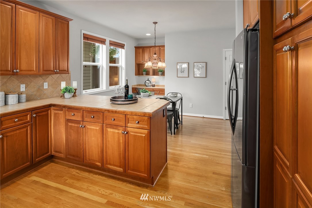 17018 166th Place Southeast Renton, WA 98058 - Photo 6 of 34 a kitchen with sink cabinets and window