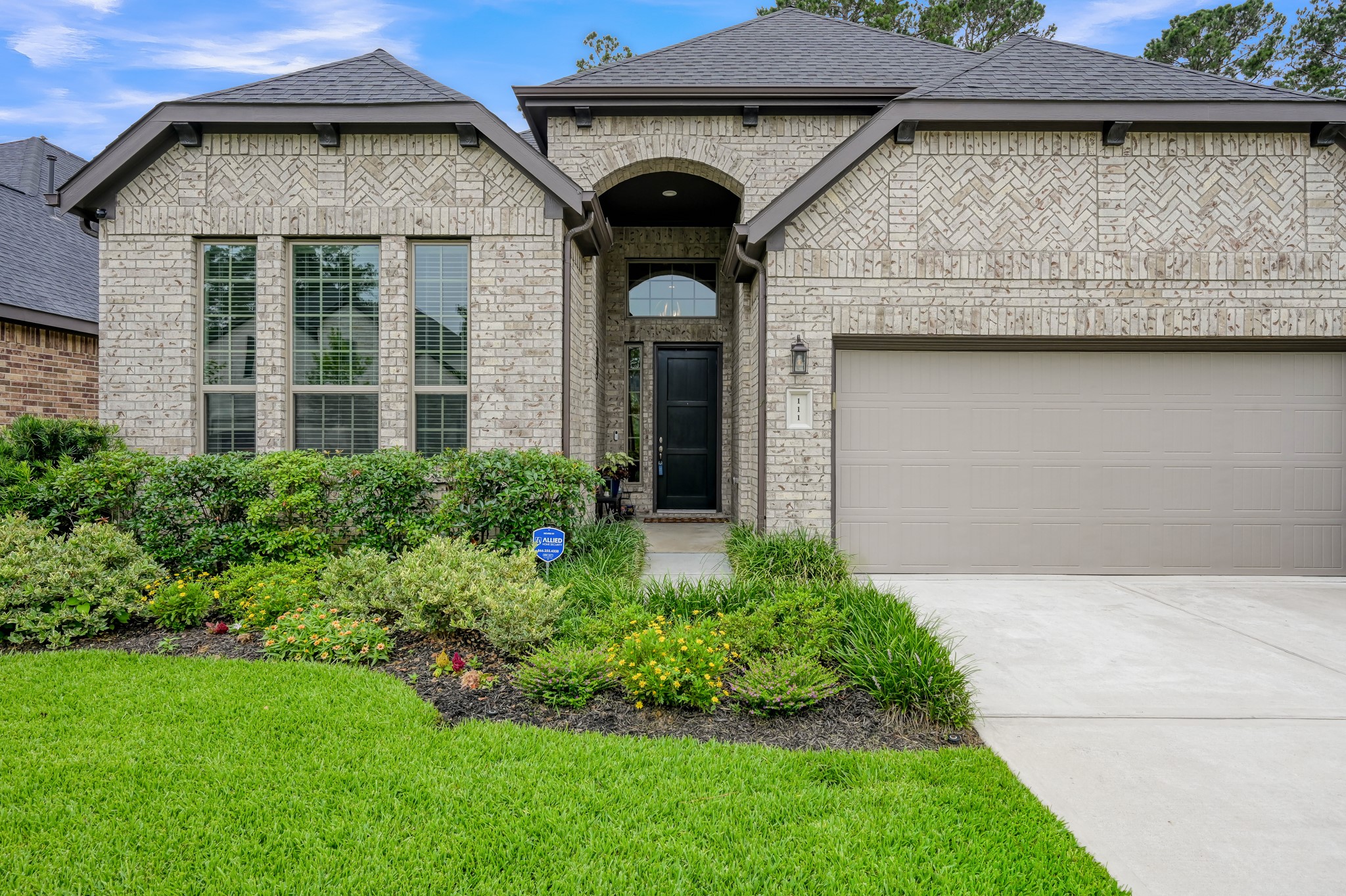 111 Yellow Perch Way Conroe, TX 77318 - Photo 2 of 35 Attractive front elevation with welcoming architectural details.