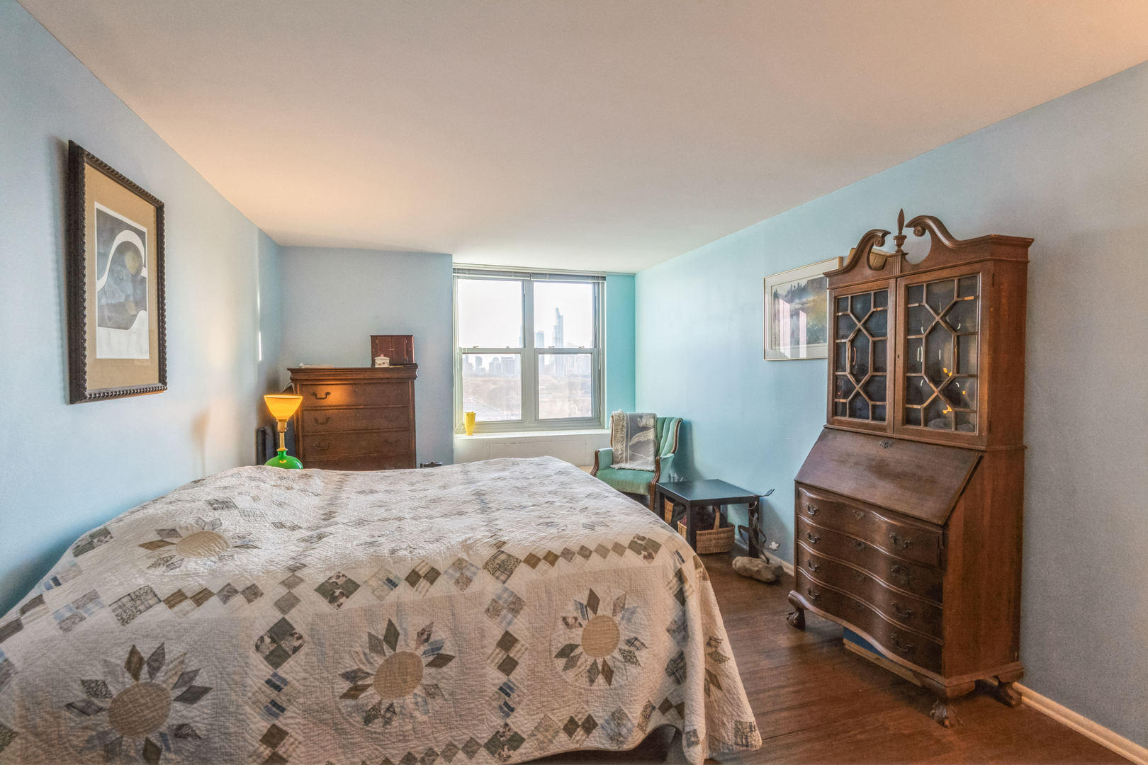 400 East Randolph Street, Unit 1515 Chicago, IL 60601 - Photo 12 of 50 a bedroom with a bed wooden floor and window